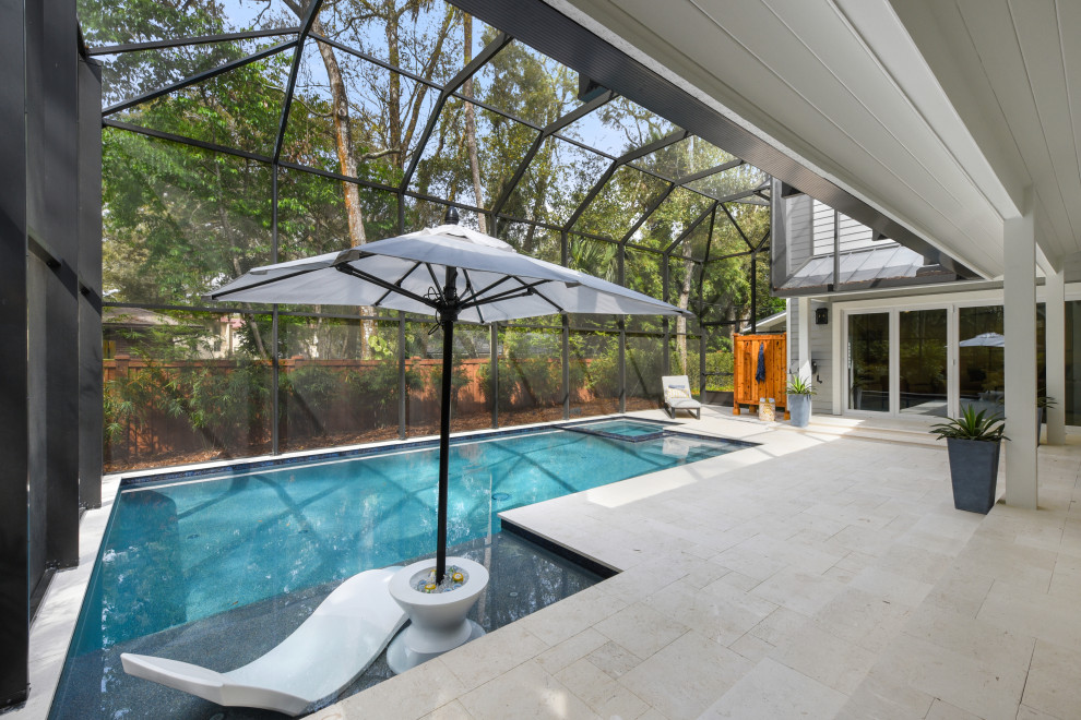 Pool - large coastal backyard stone and rectangular pool idea in Jacksonville