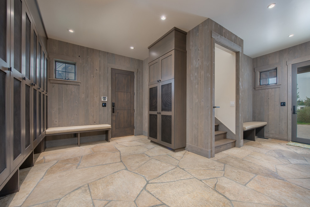 Inspiration for a rustic slate floor mudroom remodel