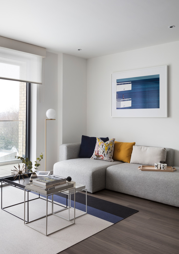 Inspiration for a contemporary brown floor living room remodel in London with white walls