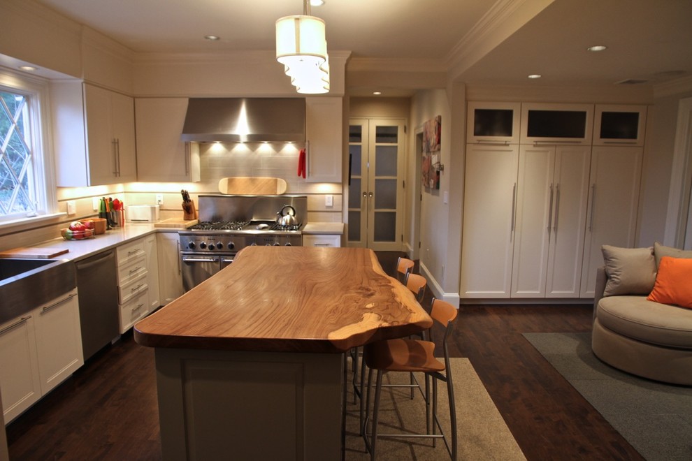 Example of a large transitional u-shaped dark wood floor kitchen pantry design in Boston with recessed-panel cabinets, white cabinets, quartz countertops, beige backsplash, porcelain backsplash, stainless steel appliances and an island