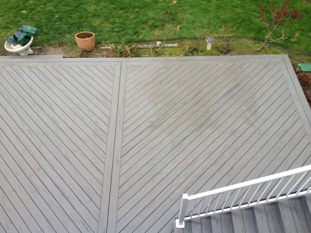This is an example of a large modern backyard deck in Seattle.