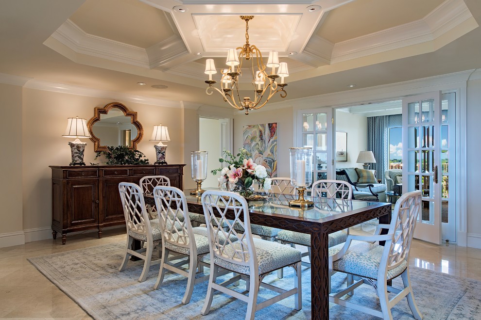 Design ideas for a traditional dining room in Miami with white walls and grey floor.