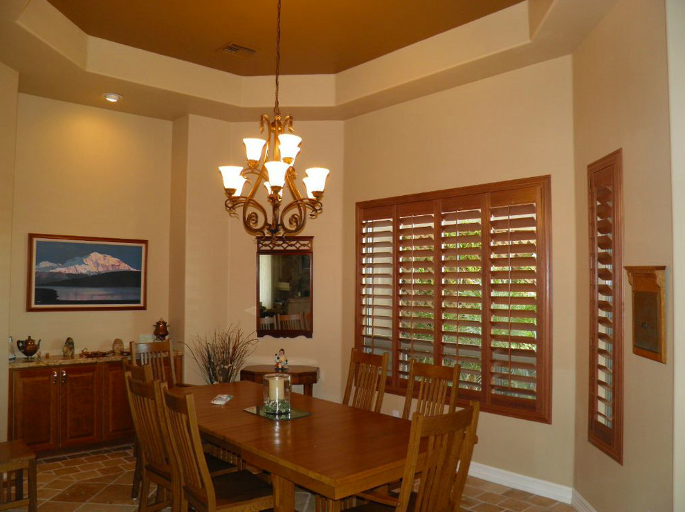 Dining room - terra-cotta tile dining room idea in Phoenix with beige walls