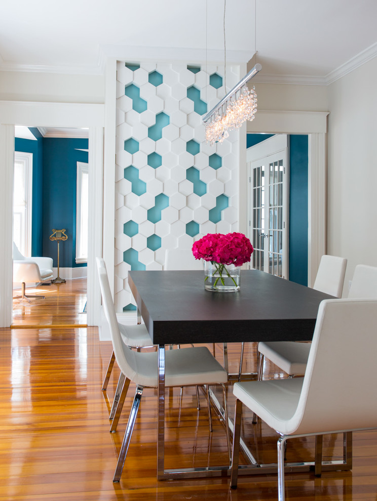 Mid-sized transitional dining room in Boston with multi-coloured walls, medium hardwood floors and no fireplace.
