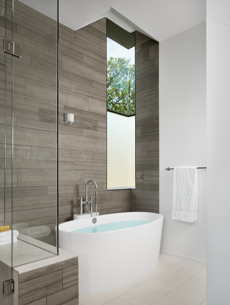 This is an example of a contemporary bathroom in Austin with a freestanding tub.