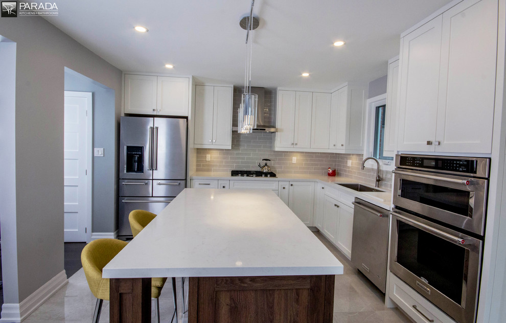 Example of a transitional kitchen design in Toronto