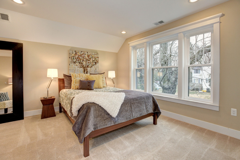 Photo of a large arts and crafts guest bedroom in DC Metro with beige walls and carpet.