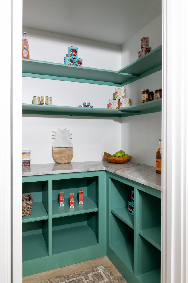 This is an example of a kitchen pantry in Kansas City with turquoise cabinets, engineered stone countertops, light hardwood flooring, beige floors and multicoloured worktops.