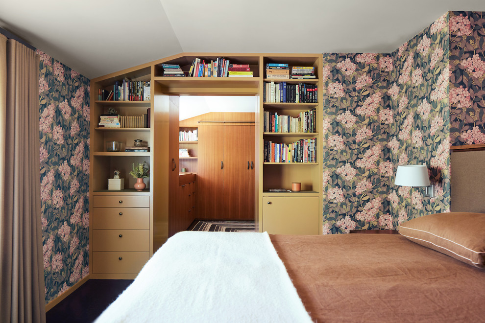 This is an example of a midcentury bedroom in San Francisco with multi-coloured walls and brown floor.