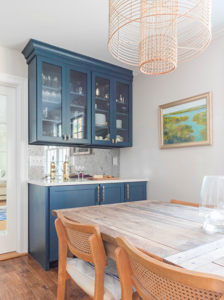 Eat-in kitchen - mid-sized transitional l-shaped light wood floor and brown floor eat-in kitchen idea in Boston with a single-bowl sink, shaker cabinets, blue cabinets, quartzite countertops, white backsplash, stone slab backsplash, stainless steel appliances, an island and white countertops