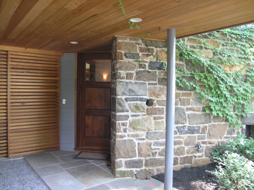 Design ideas for an arts and crafts grey exterior in Philadelphia with stone veneer.