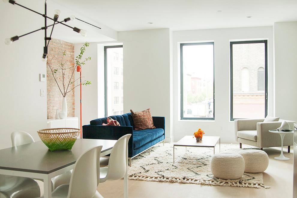 This is an example of a mid-sized contemporary formal open concept living room in New York with white walls.