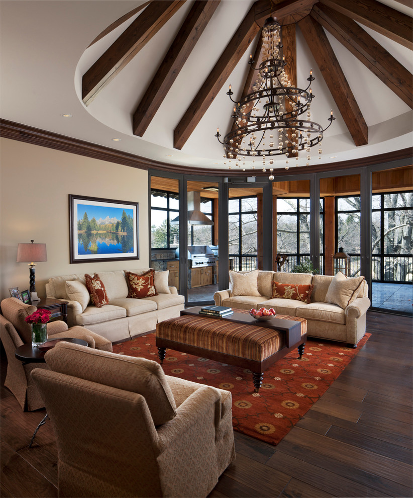Traditional family room in Detroit with beige walls and dark hardwood floors.