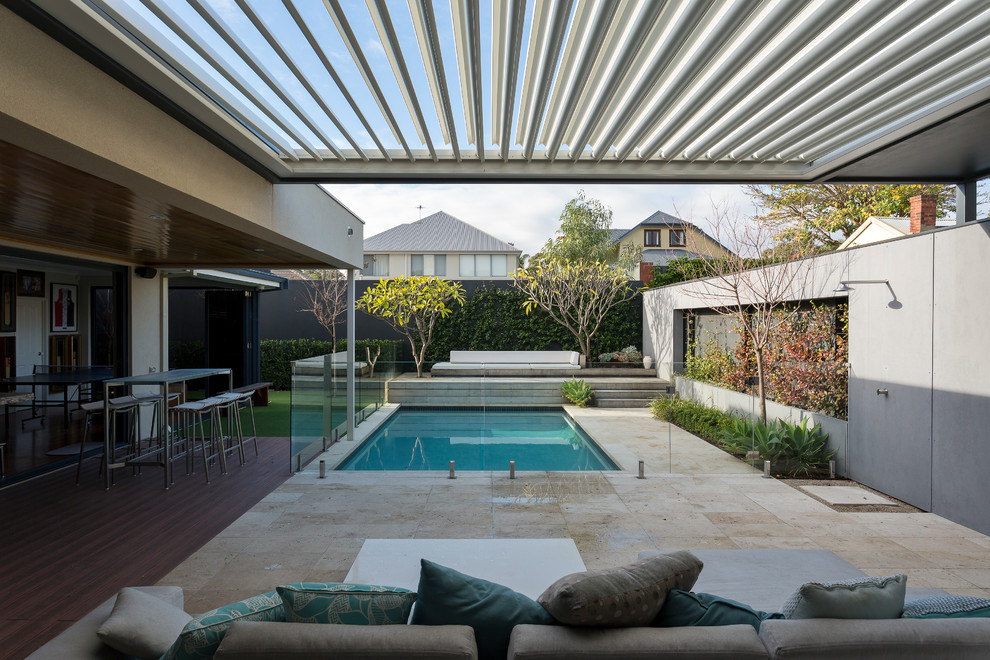 Mid-sized backyard concrete paver and rectangular pool photo in Perth