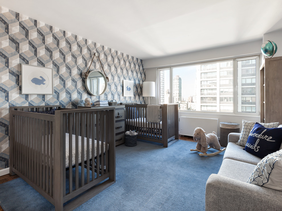 Photo of a transitional gender-neutral nursery in New York with multi-coloured walls, carpet and blue floor.