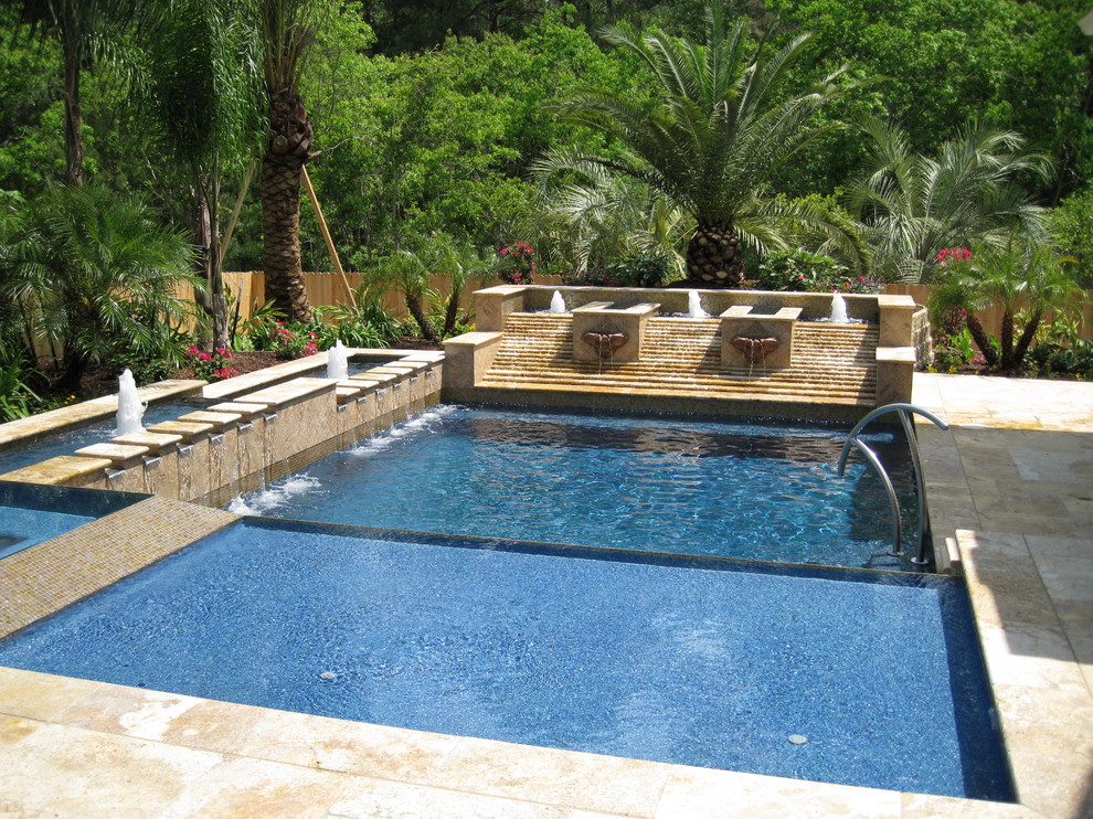 Mid-sized traditional pool in Houston.