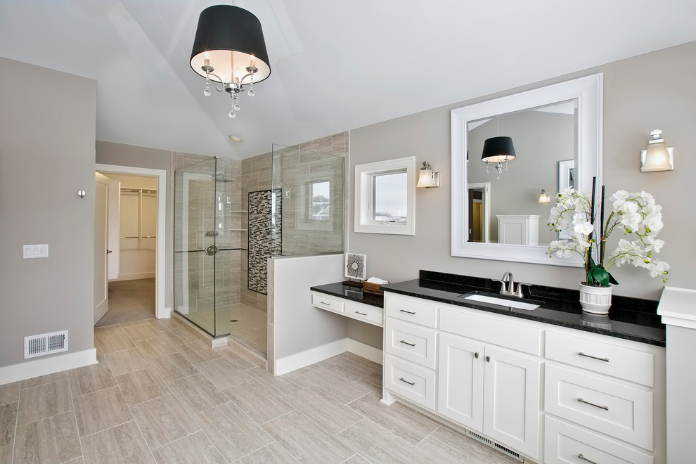This is an example of a transitional bathroom in Minneapolis with white cabinets, beige tile, porcelain tile, grey walls and granite benchtops.