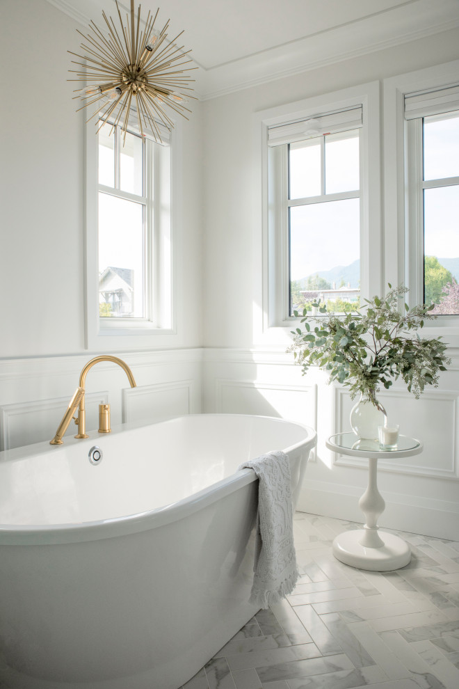 Example of a transitional porcelain tile, white floor and wainscoting freestanding bathtub design in Vancouver with white walls