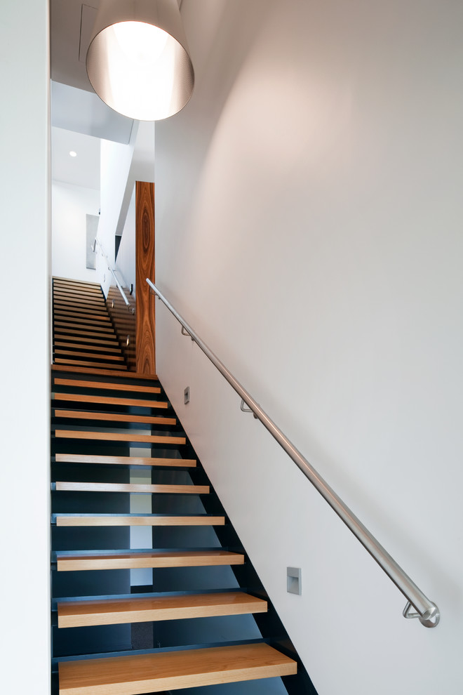 Contemporary straight staircase in Sydney with open risers.
