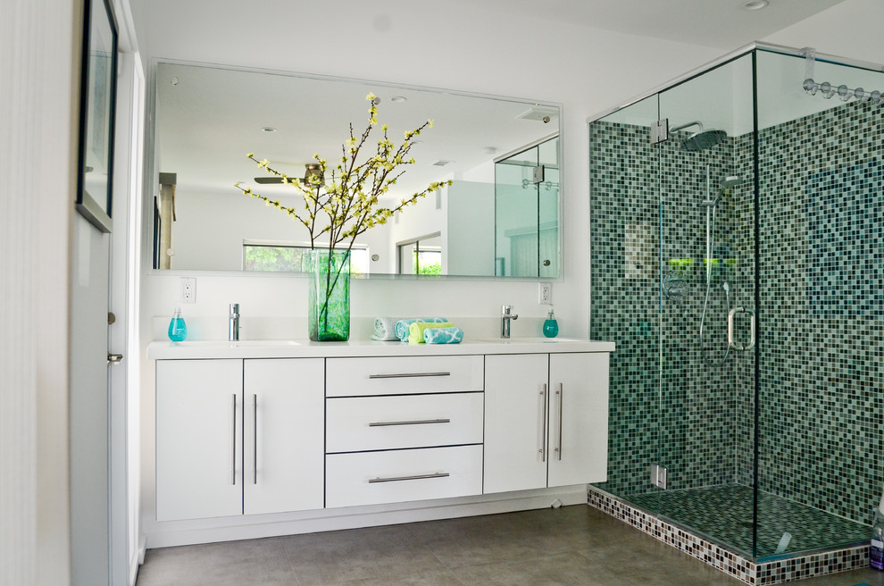 This is an example of a large contemporary 3/4 bathroom in Other with an undermount sink, flat-panel cabinets, white cabinets, engineered quartz benchtops, a corner shower, a one-piece toilet, white tile, glass tile, yellow walls and porcelain floors.
