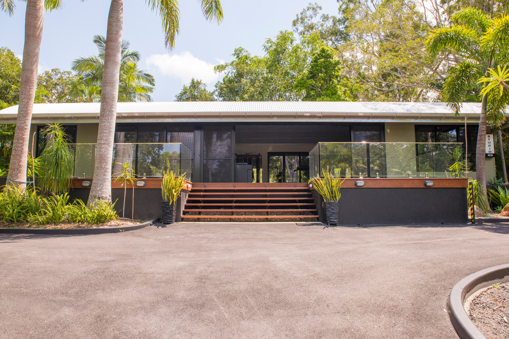 This is an example of a small tropical one-storey exterior in Sunshine Coast.