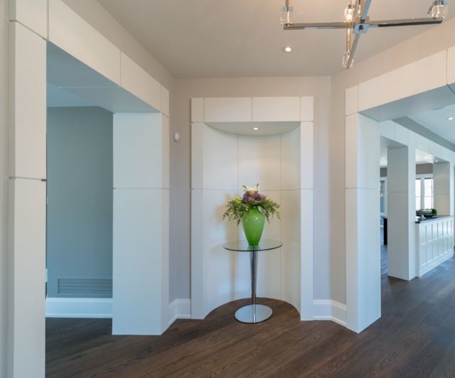 Inspiration for a large transitional hallway in Toronto with grey walls and medium hardwood floors.