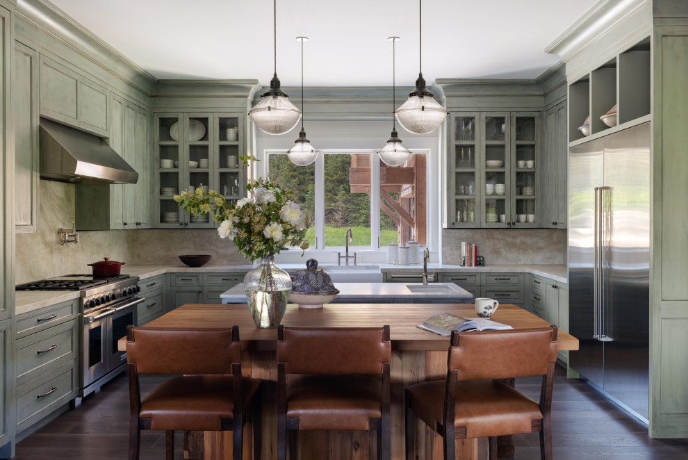 Mountain style dark wood floor kitchen photo with a farmhouse sink and stainless steel appliances