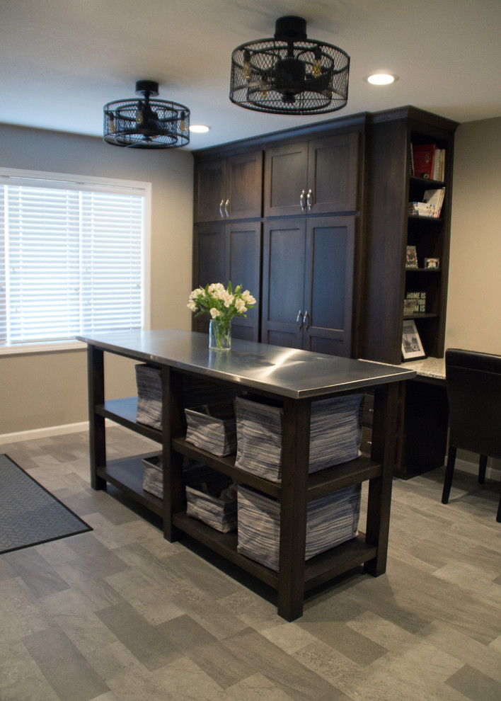Utility room - transitional gray floor utility room idea with an utility sink, recessed-panel cabinets, granite countertops, gray walls and a side-by-side washer/dryer