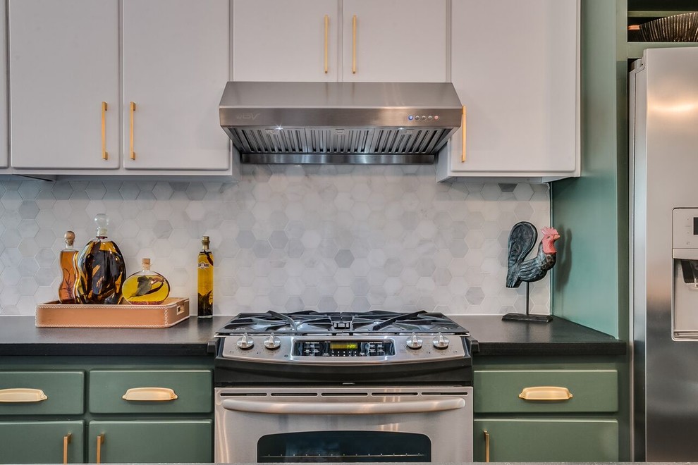 Enclosed kitchen - mid-sized transitional l-shaped concrete floor and brown floor enclosed kitchen idea in Phoenix with an undermount sink, flat-panel cabinets, green cabinets, gray backsplash, marble backsplash, stainless steel appliances and an island