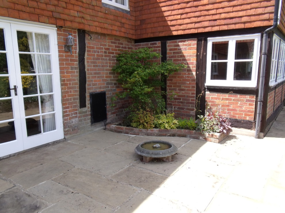 Design ideas for a small country patio in Kent.