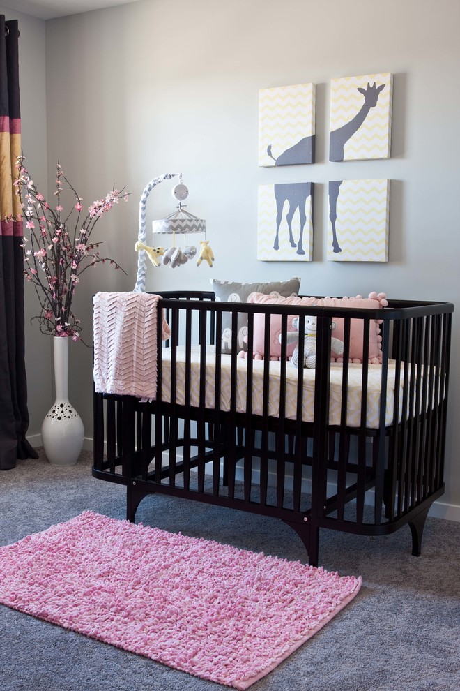Inspiration for a mid-sized contemporary nursery in Calgary with grey walls and carpet.