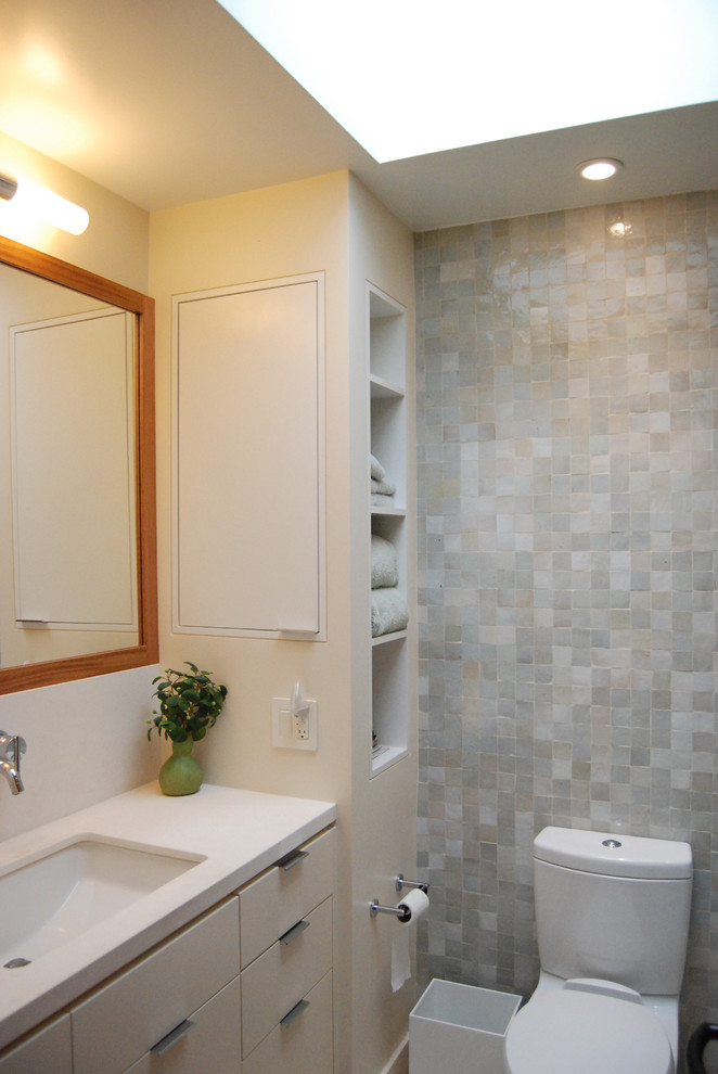 Photo of a contemporary bathroom in San Francisco with white cabinets.