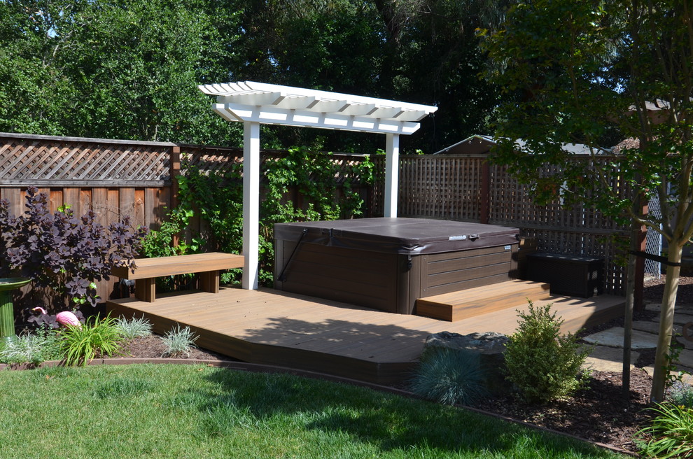 Photo of a mid-sized contemporary backyard partial sun garden for summer in San Francisco with decking.