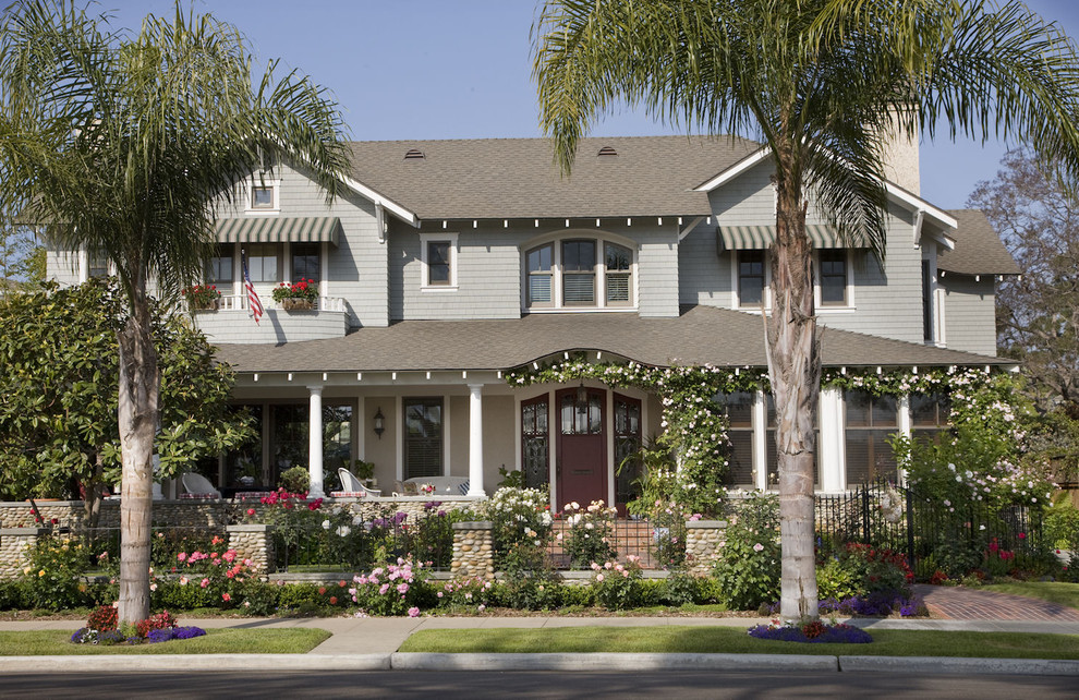This is an example of a traditional exterior in San Diego with wood siding.