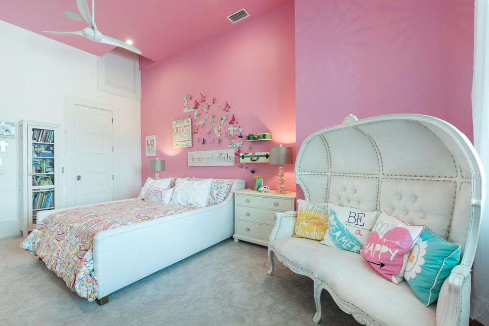 Large traditional kids' room in Orlando with pink walls and carpet for girls.