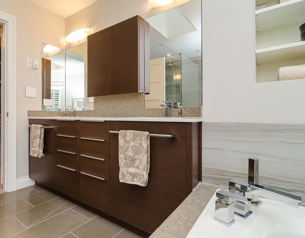 Inspiration for a mid-sized contemporary master bathroom in Vancouver with an undermount sink, flat-panel cabinets, medium wood cabinets, engineered quartz benchtops, a drop-in tub, beige tile, ceramic tile and ceramic floors.