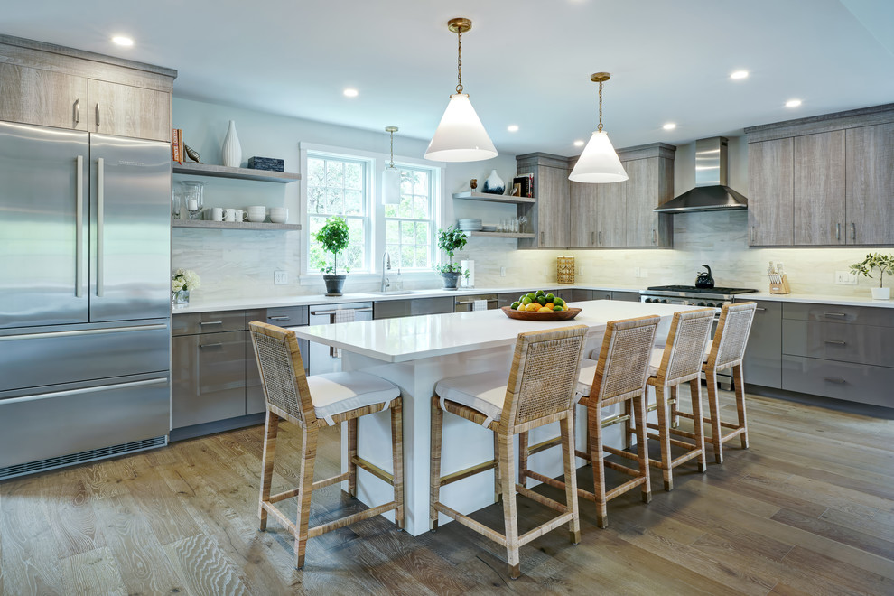 Eat-in kitchen - mid-sized l-shaped medium tone wood floor and beige floor eat-in kitchen idea with an undermount sink, flat-panel cabinets, medium tone wood cabinets, quartz countertops, gray backsplash, porcelain backsplash, stainless steel appliances, an island and white countertops