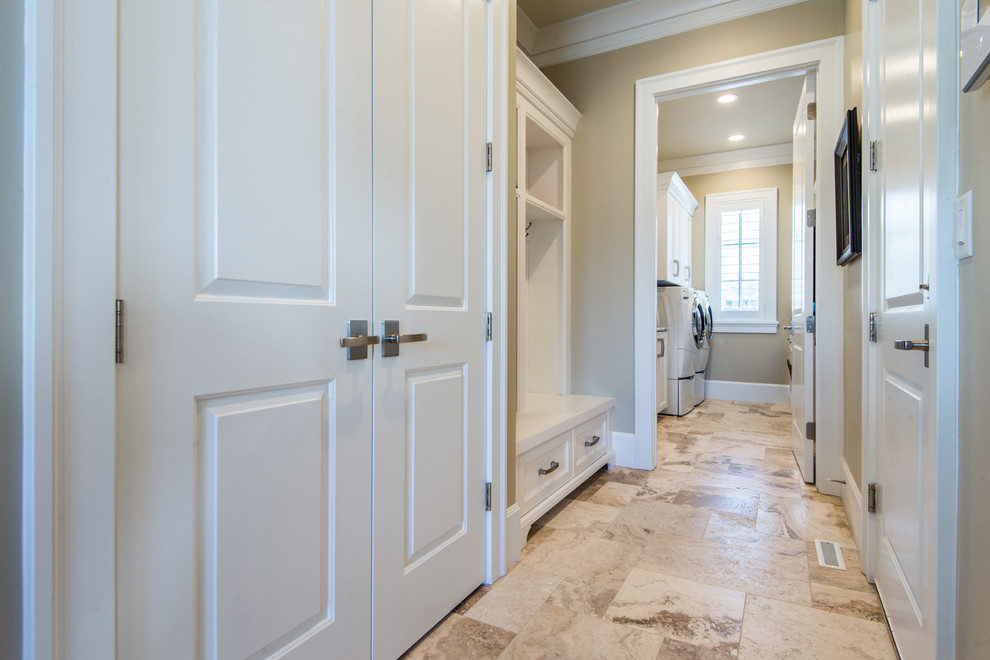 Photo of a mid-sized traditional hallway in Salt Lake City with beige walls and travertine floors.