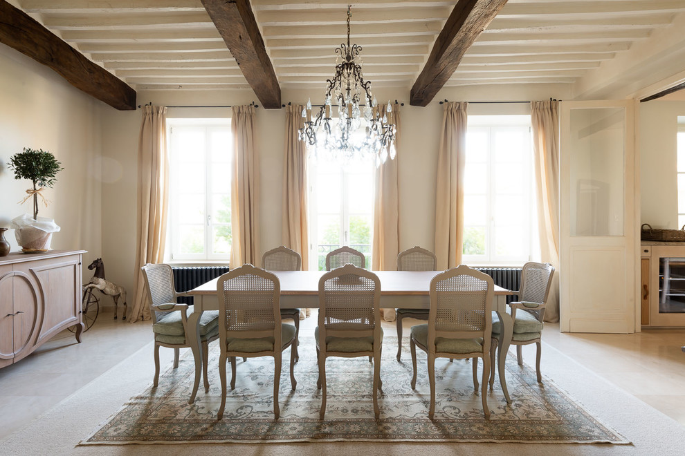 Traditional separate dining room in Marseille with no fireplace, beige floor and white walls.