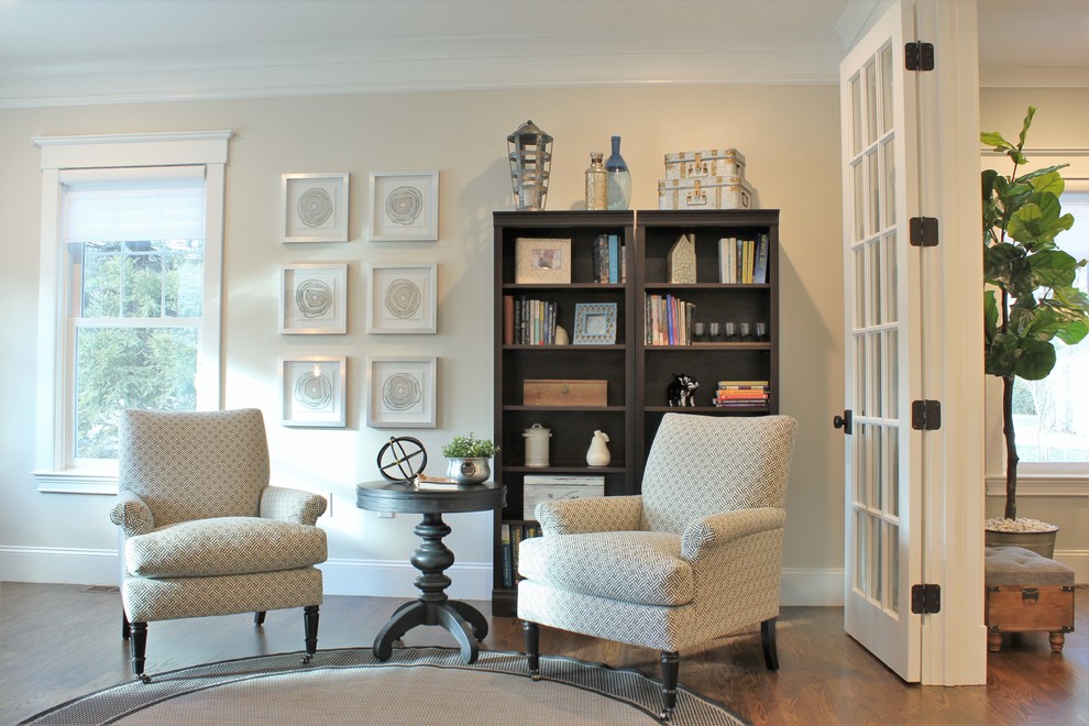 Study room - large transitional freestanding desk dark wood floor and brown floor study room idea in Boston with beige walls