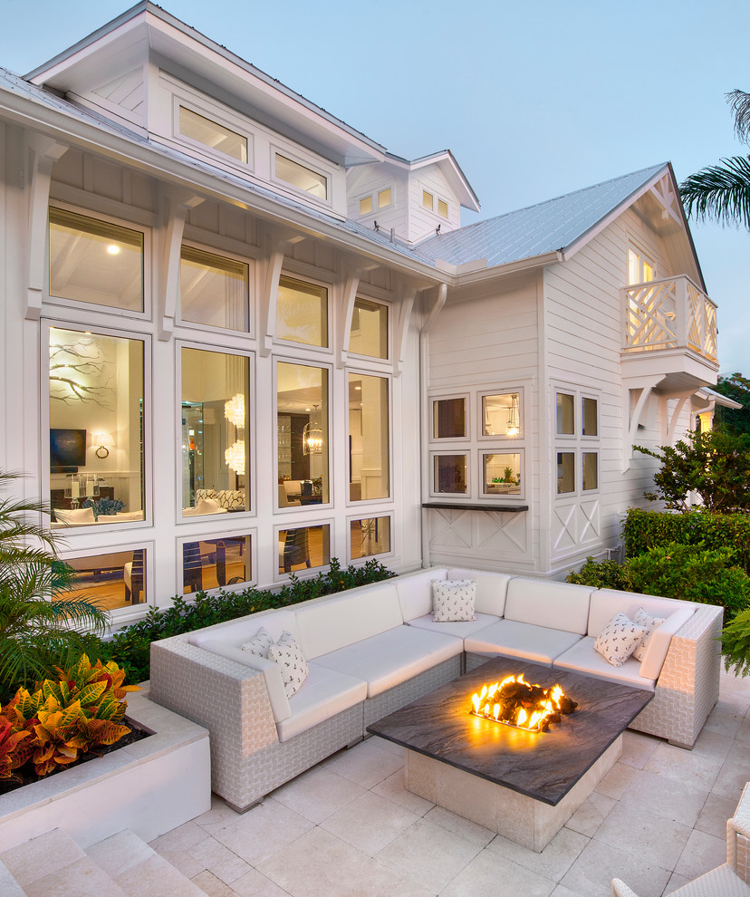 Design ideas for a beach style patio in Miami with a fire feature and no cover.