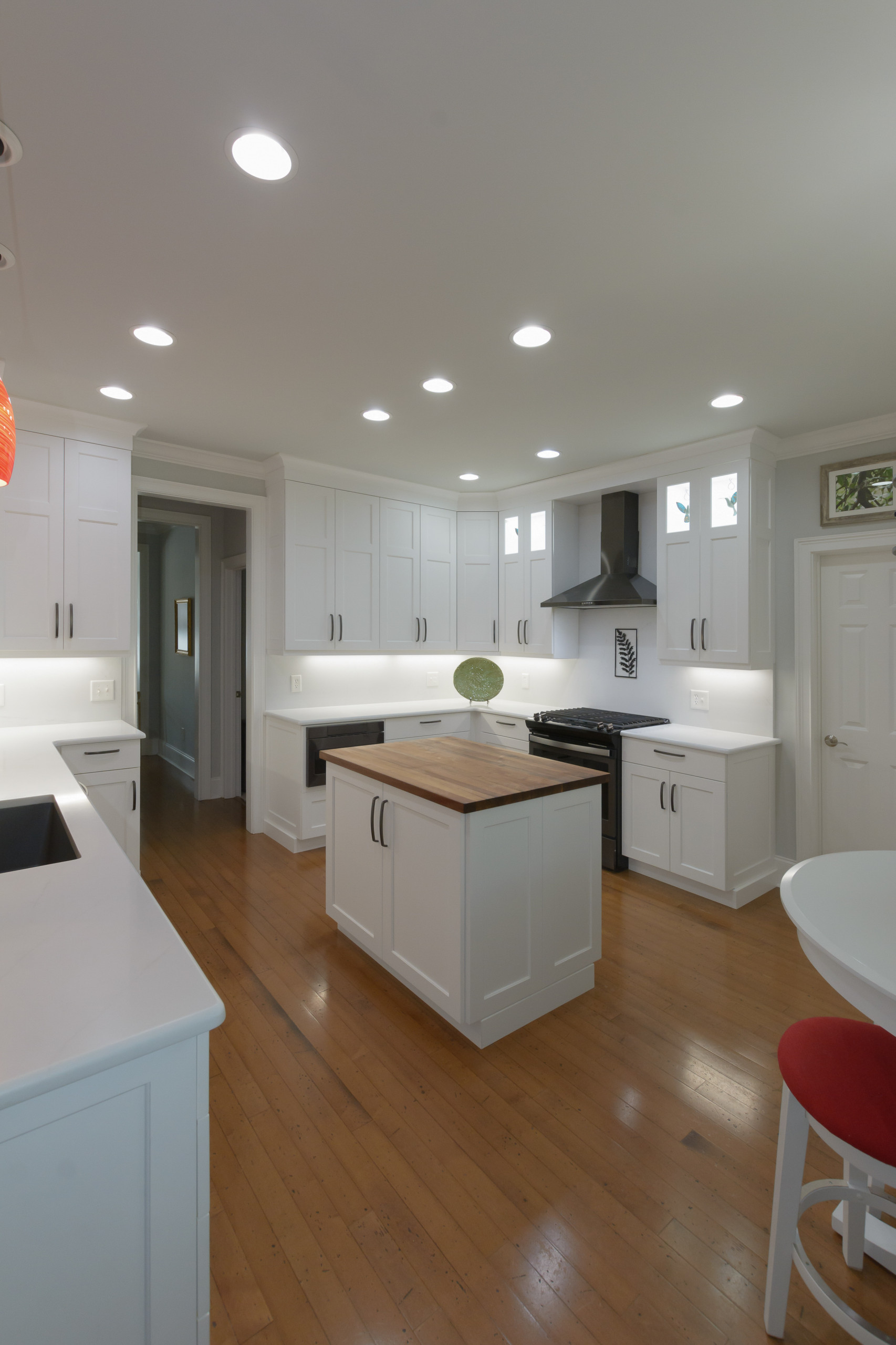 Pawley's Island modern white kitchen with butcher block island