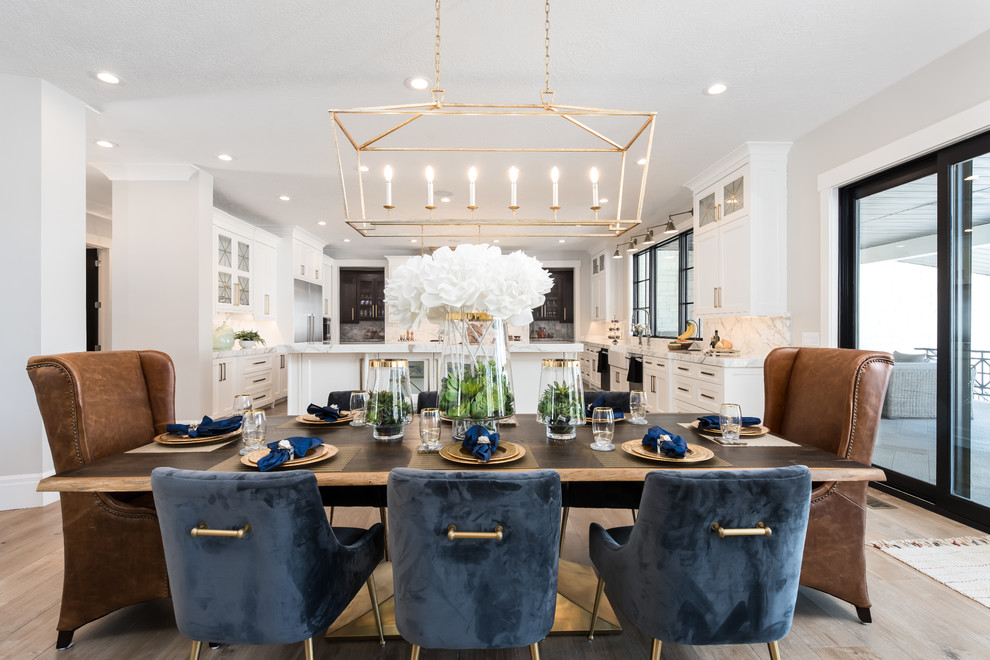 This is an example of a large transitional kitchen/dining combo in Salt Lake City with grey walls, light hardwood floors, no fireplace and beige floor.