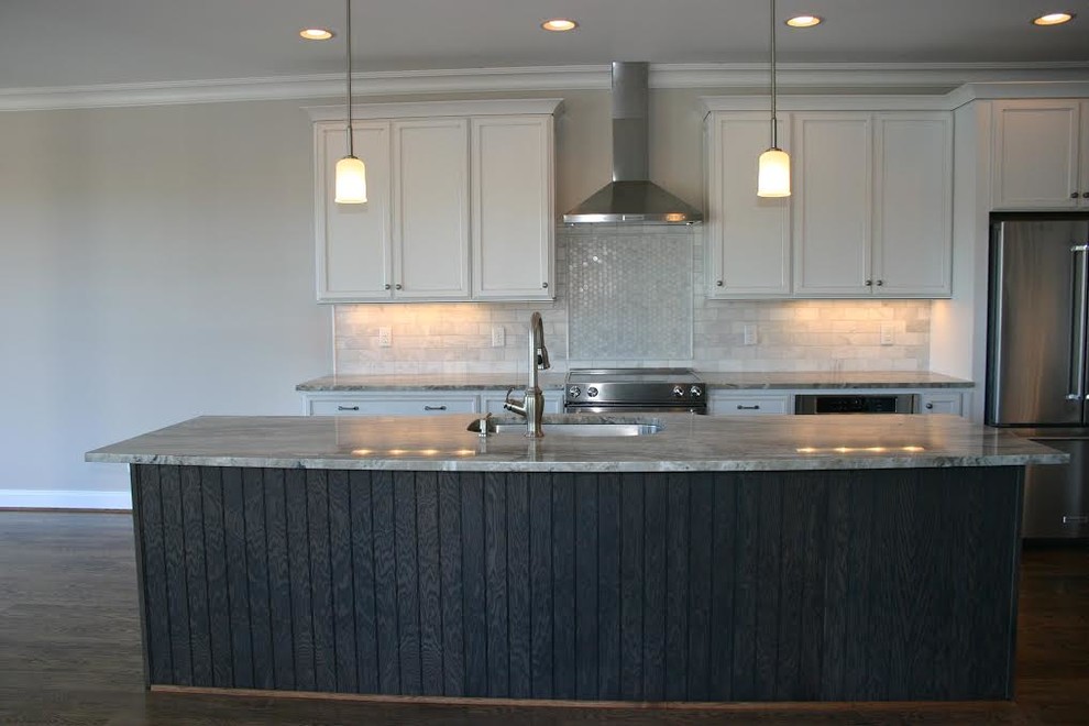 Example of a large transitional u-shaped dark wood floor eat-in kitchen design in Baltimore with a double-bowl sink, raised-panel cabinets, light wood cabinets, granite countertops, black backsplash, stainless steel appliances and no island