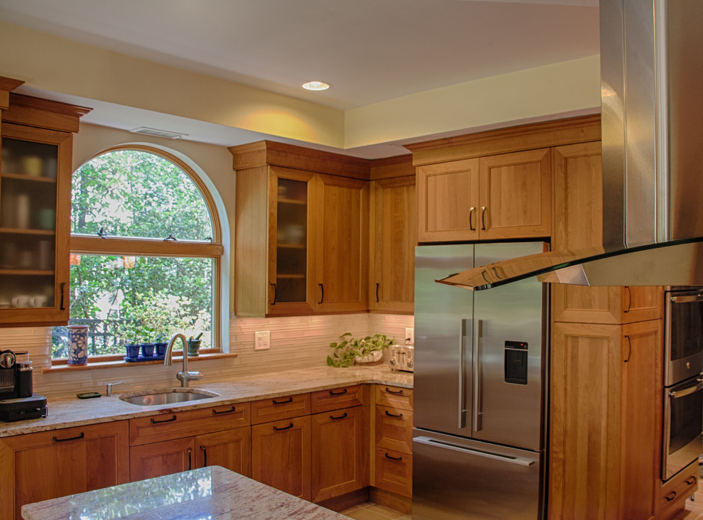 Design ideas for a mid-sized traditional l-shaped open plan kitchen in DC Metro with an undermount sink, beaded inset cabinets, light wood cabinets, granite benchtops, beige splashback, stone slab splashback, stainless steel appliances, a peninsula, terra-cotta floors and beige floor.