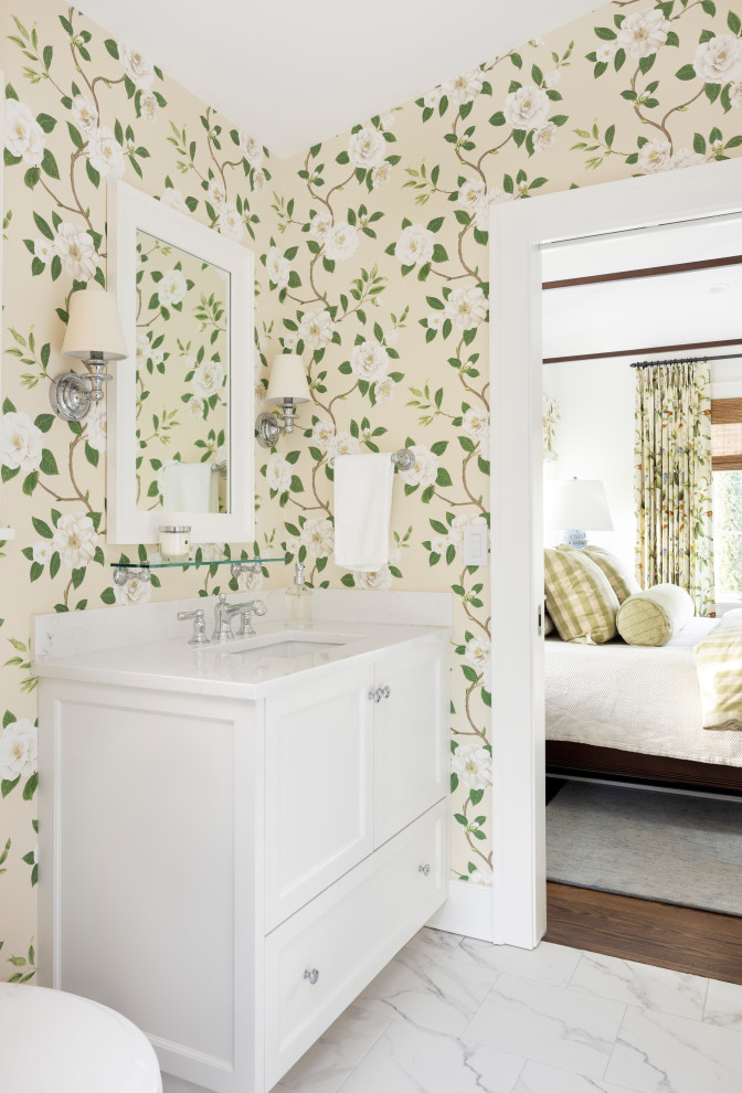 Inspiration for a mid-sized traditional bathroom in Portland with beaded inset cabinets, white cabinets, engineered quartz benchtops, white benchtops, a single vanity, a built-in vanity and wallpaper.