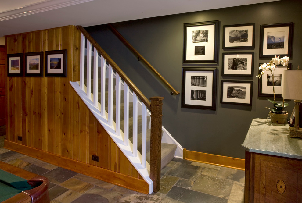Basement - transitional ceramic tile basement idea in Chicago with black walls and a standard fireplace