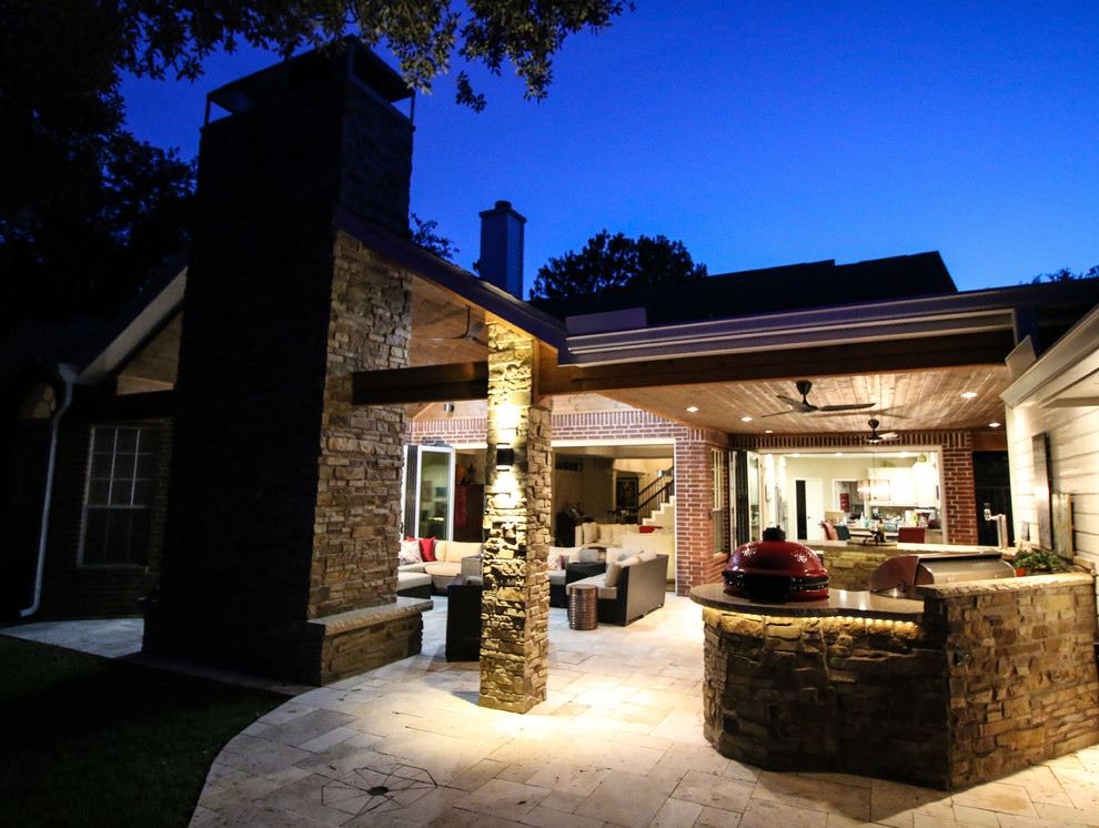 Design ideas for a traditional backyard patio in Houston with natural stone pavers.