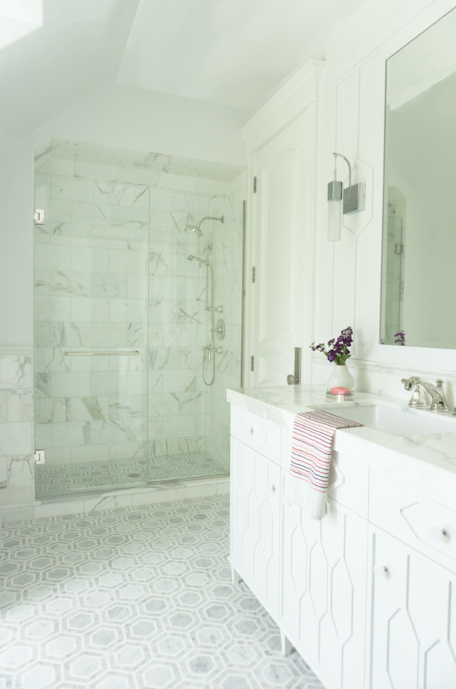 Inspiration for a large transitional bathroom in Chicago with furniture-like cabinets, white cabinets, an alcove shower, white tile, marble, grey walls, marble floors, an undermount sink, marble benchtops, white floor, a hinged shower door and white benchtops.