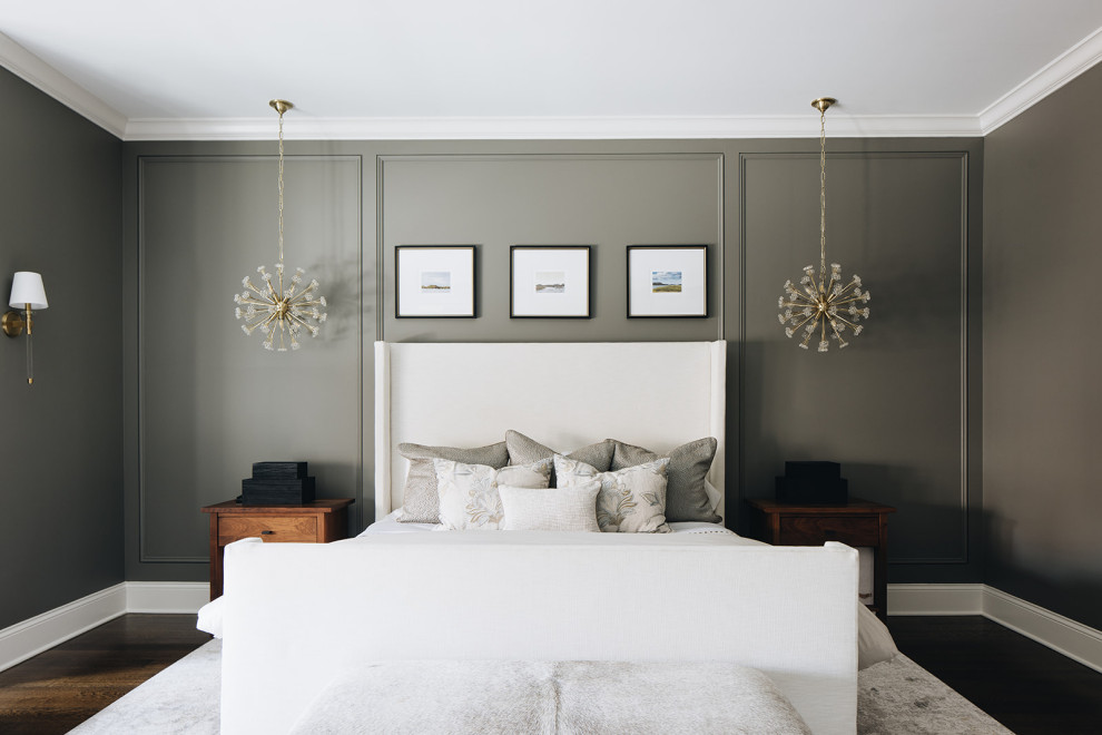 Design ideas for a large transitional master bedroom in Chicago with grey walls, medium hardwood floors, a standard fireplace, a stone fireplace surround, brown floor, coffered and decorative wall panelling.
